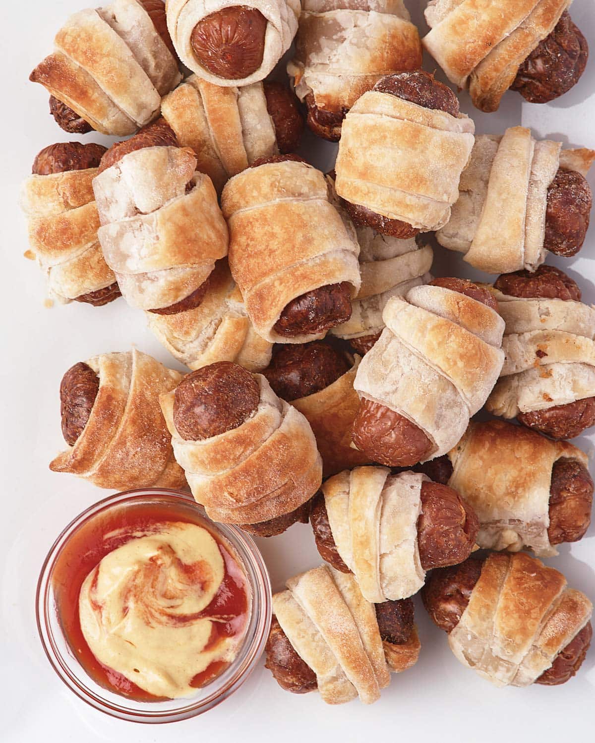 plate of air fried pigs in a blanket.