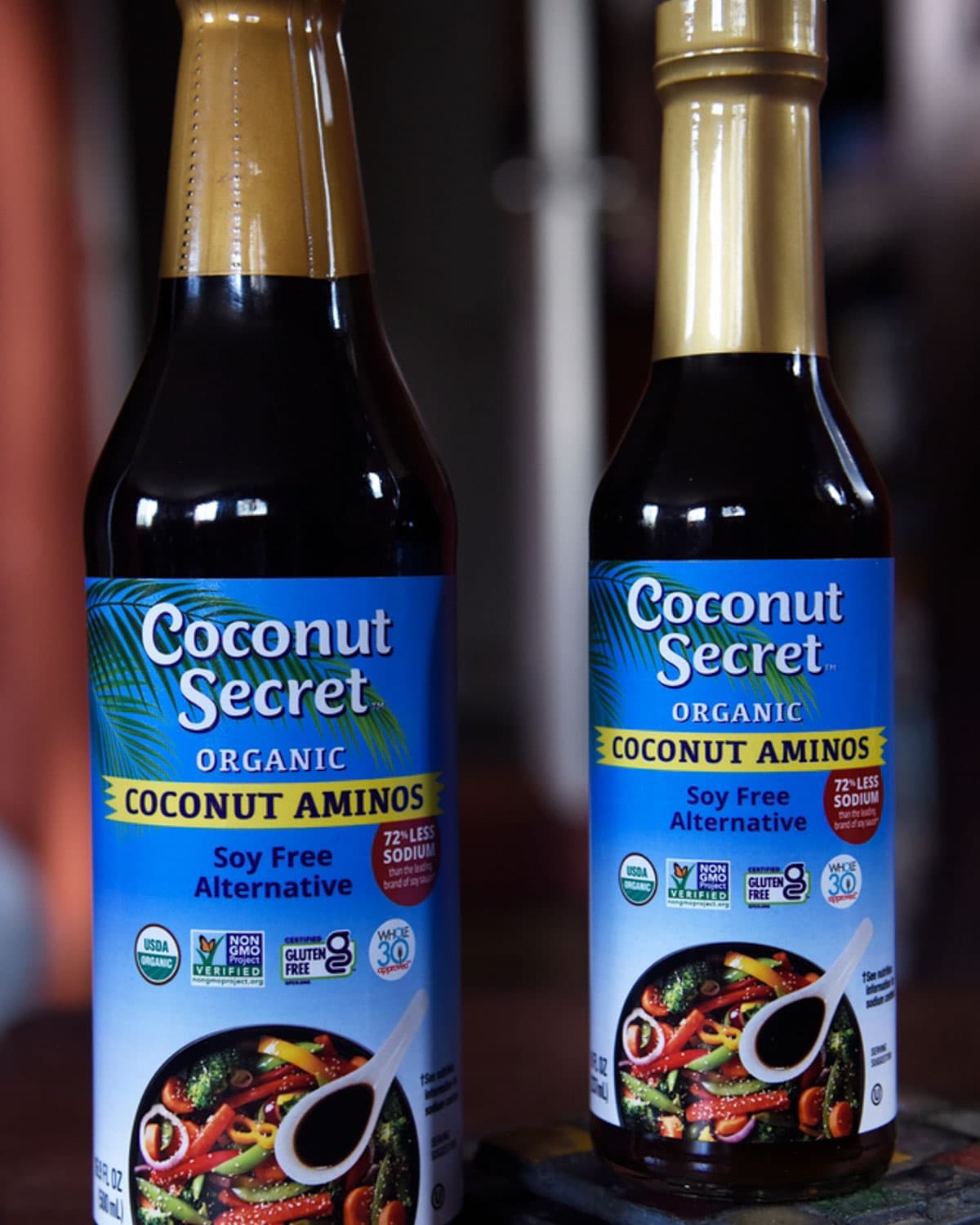 two bottles of coconut secret organic coconut aminos soy free alternative.