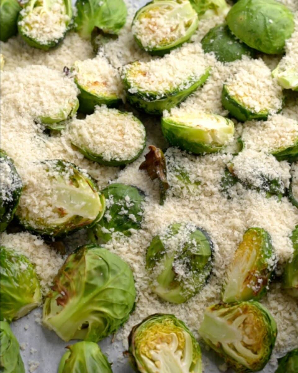 Brussel Sprouts air fried halfway sprinkled with parmesan and panko breadcrumbs.