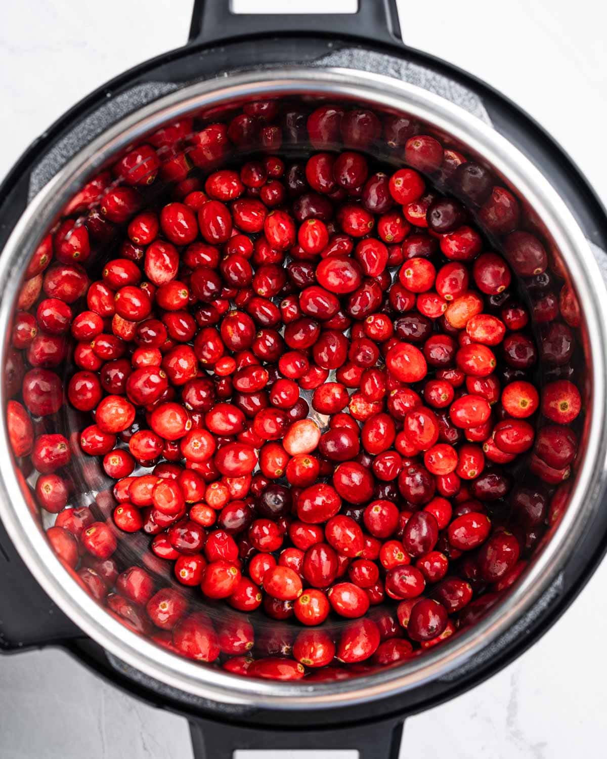 Instant pot with fresh cranberries.