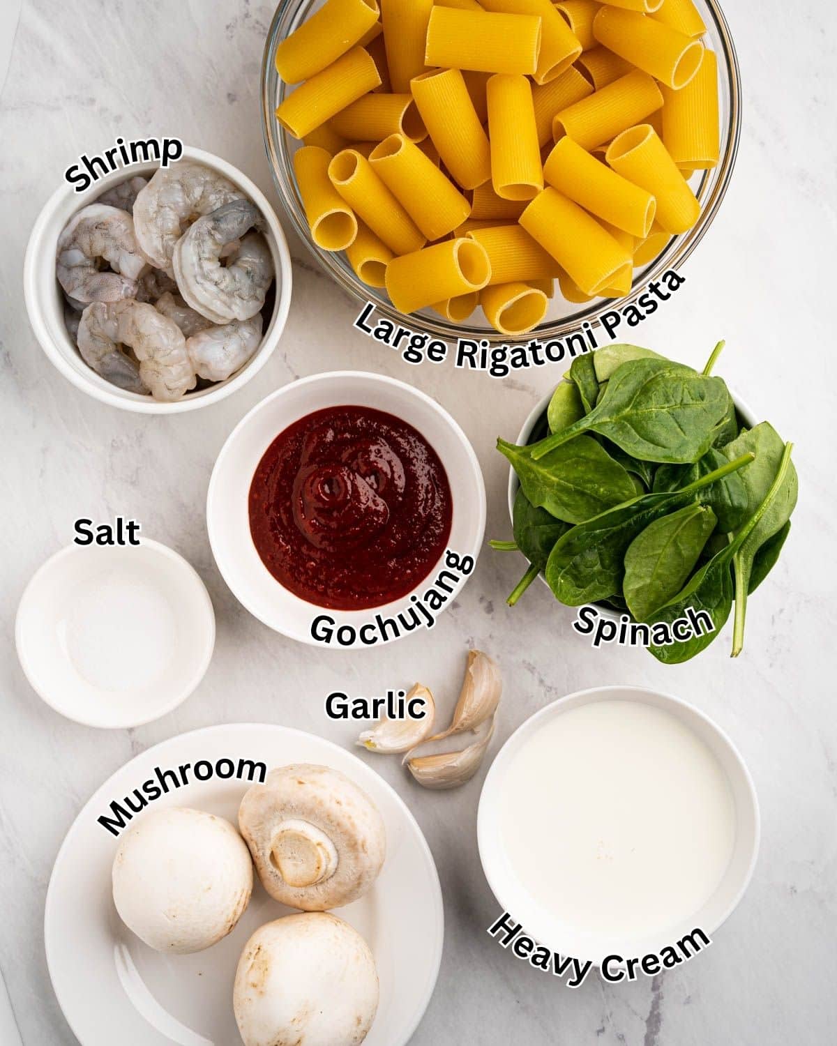 Labeled ingredients needed to make gochujang pasta with shrimp.